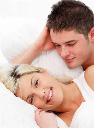 simsearch:400-04150404,k - Smiling girl lying with her boyfiend in bed Stock Photo - Budget Royalty-Free & Subscription, Code: 400-04125220