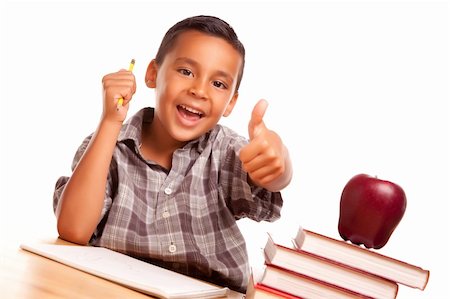 simsearch:614-02762687,k - Adorable Hispanic Boy with Books, Apple, Pencil and Paper Isolated on a White Background. Stock Photo - Budget Royalty-Free & Subscription, Code: 400-04125516