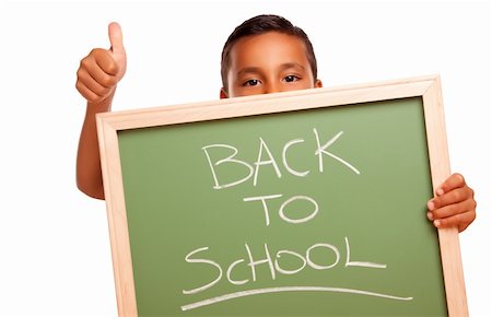 simsearch:400-04125503,k - Cute Boy hispanique Holding Chalkboard avec retour à l'école, isolé sur fond blanc. Photographie de stock - Aubaine LD & Abonnement, Code: 400-04125528