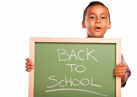 simsearch:400-04125503,k - Cute Boy hispanique Holding Chalkboard avec retour à l'école, isolé sur fond blanc. Photographie de stock - Aubaine LD & Abonnement, Code: 400-04125529