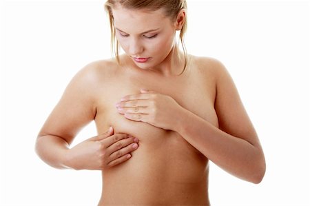 simsearch:400-07745360,k - Jeune femme adulte caucasien, examinant ses seins pour les morceaux ou les signes du cancer du sein Photographie de stock - Aubaine LD & Abonnement, Code: 400-04125731