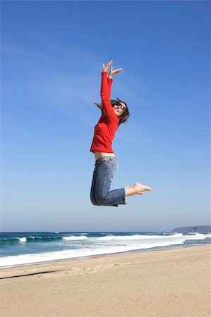 simsearch:400-04123668,k - Young woman jumping on the beach Stock Photo - Budget Royalty-Free & Subscription, Code: 400-04126226