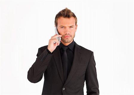 simsearch:400-04608943,k - Serious male business manager talking on mobile phone Stock Photo - Budget Royalty-Free & Subscription, Code: 400-04126244