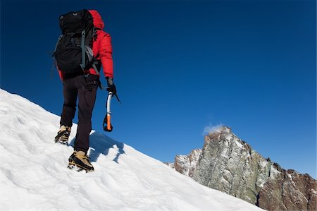 simsearch:400-04126574,k - Climber on a snowy ridge, Grivola, west italian alps, Europe. Horizontal frame. Fotografie stock - Microstock e Abbonamento, Codice: 400-04126573