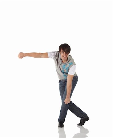 Single Caucasian male tap dancer wearing jeans showing various steps in studio with white background and reflective floor. Not isolated Stock Photo - Budget Royalty-Free & Subscription, Code: 400-04127047