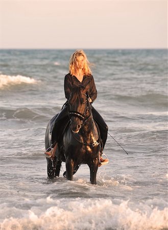 riding on horses on the beach - blond woman on her stallion in the sea Stock Photo - Budget Royalty-Free & Subscription, Code: 400-04127066