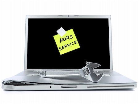 simsearch:400-04971966,k - Damaged laptop with a post-it in french meaning Out of Service and a spanner over it. Isolated on white. Stock Photo - Budget Royalty-Free & Subscription, Code: 400-04127325