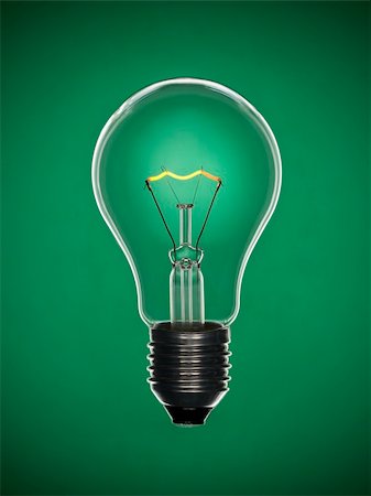simsearch:630-01709841,k - Une ampoule transparente sur un fond vert. Filament incandescent de tungstène. Photographie de stock - Aubaine LD & Abonnement, Code: 400-04127334
