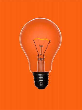 simsearch:400-04303624,k - Eine transparente Glühbirne über einen orange Hintergrund. Wolframkathode glühend. Stockbilder - Microstock & Abonnement, Bildnummer: 400-04127347