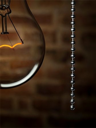 simsearch:400-04303624,k - Hautnah auf eine transparente Glühbirne mit einem Pull-Schalter Hintergrund Mauer Ziegel. Stockbilder - Microstock & Abonnement, Bildnummer: 400-04127355