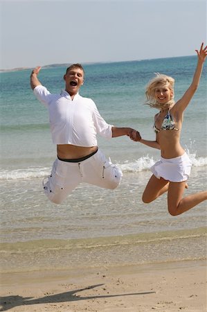 simsearch:400-06751687,k - Young couple jumping high Stock Photo - Budget Royalty-Free & Subscription, Code: 400-04128207