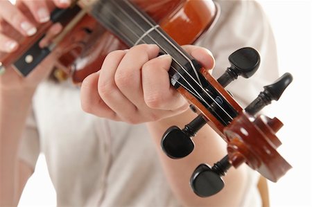 close up of girl playing the Viola against a white background Stock Photo - Budget Royalty-Free & Subscription, Code: 400-04128368