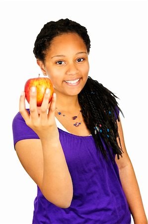 Isolated portrait of black teenage girl holding apple Foto de stock - Super Valor sin royalties y Suscripción, Código: 400-04128450