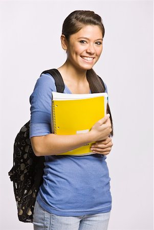Student carrying backpack and notebook Stock Photo - Budget Royalty-Free & Subscription, Code: 400-04128918