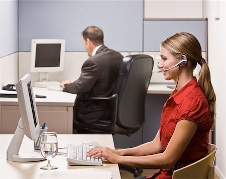 simsearch:400-04129016,k - Businesswoman talking on headset at desk Stock Photo - Budget Royalty-Free & Subscription, Code: 400-04129016