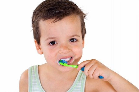 Little boy brushing his teeth - isolated, closeup Stock Photo - Budget Royalty-Free & Subscription, Code: 400-04129525