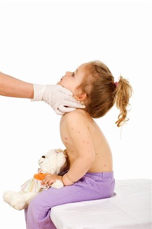 rubber hand gloves - Physician examining kid with small pox or some skin rash - isolated Stock Photo - Budget Royalty-Free & Subscription, Code: 400-04129530