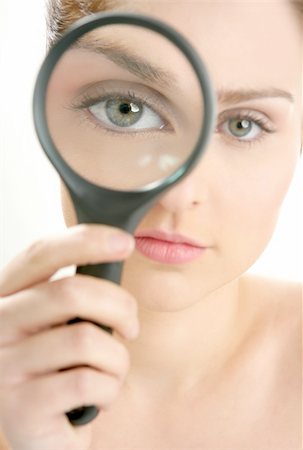 simsearch:400-04554899,k - Portrait of woman with magnifier lens on eye isolated on white Stock Photo - Budget Royalty-Free & Subscription, Code: 400-04129606
