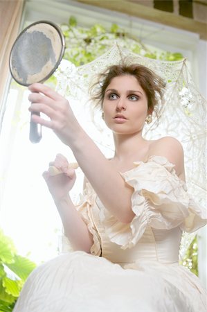 Victorian beautiful woman, white dress at home looking hand mirror Stock Photo - Budget Royalty-Free & Subscription, Code: 400-04129653