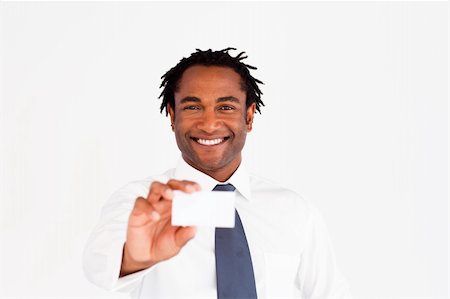 Businessman showing his business card, smiling at the camera Stock Photo - Budget Royalty-Free & Subscription, Code: 400-04129731