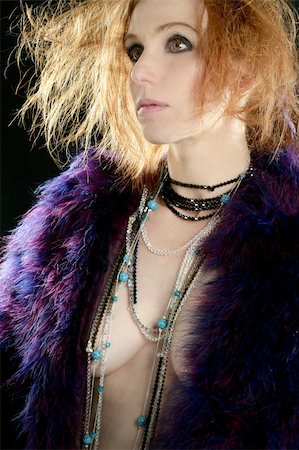 simsearch:400-04873499,k - Beautiful sexy redhead woman with feather coat and jewelry, over black Stock Photo - Budget Royalty-Free & Subscription, Code: 400-04129846