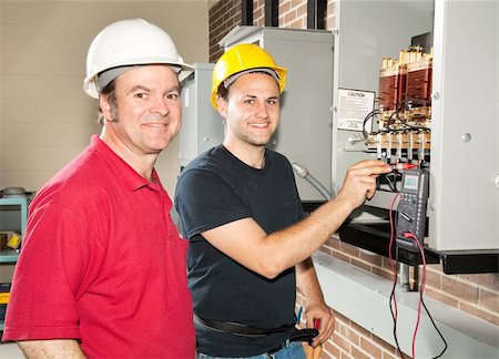 distribution center - Apprentice electrician and his instructor reading the voltage on a power distribution center. Stock Photo - Budget Royalty-Free & Subscription, Code: 400-04129912