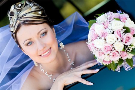 simsearch:400-04762831,k - happy bride with flower bouquet siting in the car Stock Photo - Budget Royalty-Free & Subscription, Code: 400-04120182