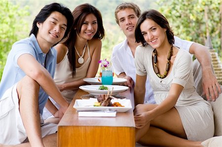 eastwestimaging (artist) - A group of young adults having lunch on vacation Foto de stock - Super Valor sin royalties y Suscripción, Código: 400-04120273