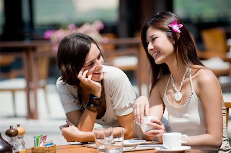 eastwestimaging (artist) - Two attractive women at breakfast on vacation Fotografie stock - Microstock e Abbonamento, Codice: 400-04120295