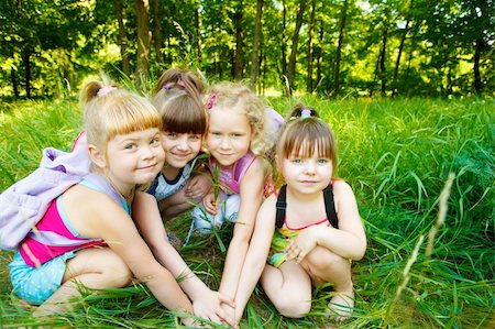 simsearch:400-05352235,k - Four lovely friends playing in the park Photographie de stock - Aubaine LD & Abonnement, Code: 400-04120424