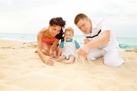 Mother, father and baby playing on the beach Stock Photo - Budget Royalty-Free & Subscription, Code: 400-04120431