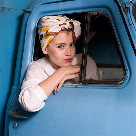 portrait pin-up young woman from the car Stock Photo - Budget Royalty-Free & Subscription, Code: 400-04120971