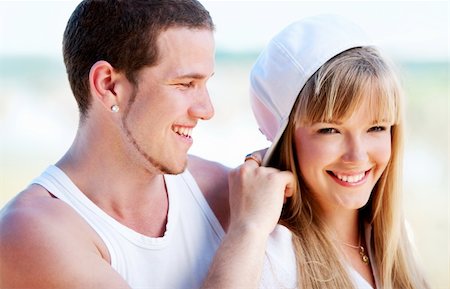 simsearch:400-04702706,k - Happy couple standing on the beach near the ocean Stockbilder - Microstock & Abonnement, Bildnummer: 400-04121129