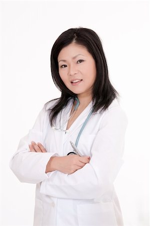 simsearch:400-05172792,k - Beautiful Asian woman Doctor or Nurse standing at a desk Foto de stock - Royalty-Free Super Valor e Assinatura, Número: 400-04121329