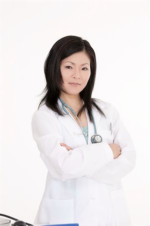 simsearch:400-05172792,k - Beautiful Asian woman Doctor/Nurse standing at a desk Foto de stock - Royalty-Free Super Valor e Assinatura, Número: 400-04121330