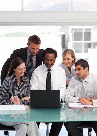 International business team using a laptop together Stock Photo - Budget Royalty-Free & Subscription, Code: 400-04121377