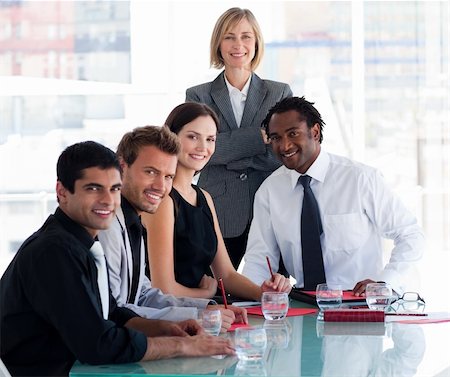 sales training - International business team smiling at the camera in office Stock Photo - Budget Royalty-Free & Subscription, Code: 400-04121384