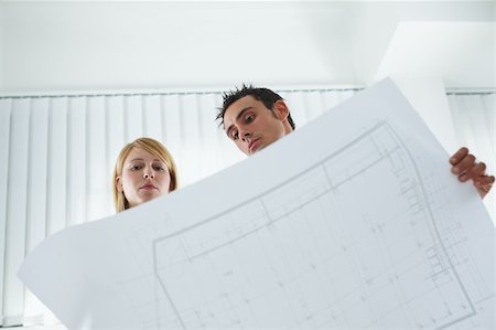 simsearch:400-04238062,k - two architects examining blueprint indoors. Low angle view. Copy space Photographie de stock - Aubaine LD & Abonnement, Code: 400-04121625