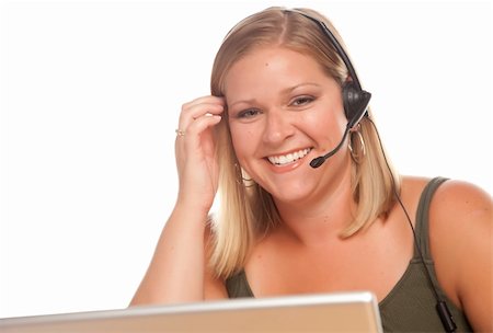 simsearch:400-04167141,k - Attractive businesswoman smiles as she talks on her phone headset. Foto de stock - Super Valor sin royalties y Suscripción, Código: 400-04121851