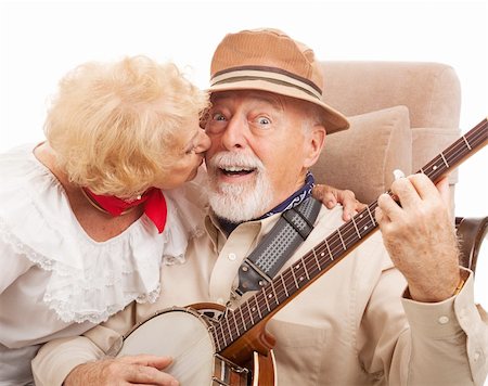 surprised old man with a beard - Senior man playing banjo for his lady is rewarded with a kiss. Stock Photo - Budget Royalty-Free & Subscription, Code: 400-04121871