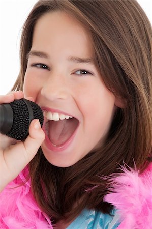 Caucasian children singing karaoke on a white background Stock Photo - Budget Royalty-Free & Subscription, Code: 400-04122264