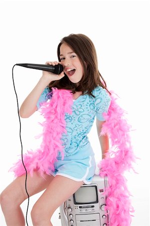 Caucasian children singing karaoke on a white background Stock Photo - Budget Royalty-Free & Subscription, Code: 400-04122262