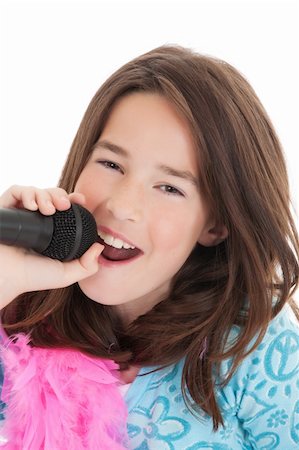 Caucasian children singing karaoke on a white background Stock Photo - Budget Royalty-Free & Subscription, Code: 400-04122263