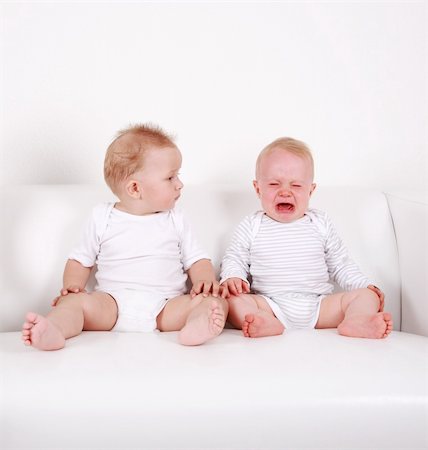 Two swert babies - one looking, one crying Stock Photo - Budget Royalty-Free & Subscription, Code: 400-04123015