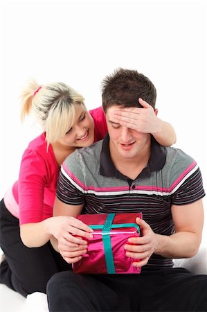 simsearch:400-04150404,k - Beautiful girl giving her boyfriend a present Stock Photo - Budget Royalty-Free & Subscription, Code: 400-04123195