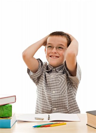 simsearch:400-04622920,k - Happy schoolboy fined the solution to do his homework - isolated Fotografie stock - Microstock e Abbonamento, Codice: 400-04123385