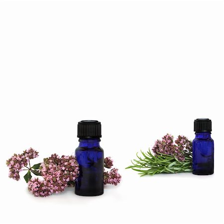 simsearch:400-07175956,k - Rosemary herb leaf sprigs and marjoram flowers with aromatherapy essential oil glass bottles, over white background. Stock Photo - Budget Royalty-Free & Subscription, Code: 400-04123632