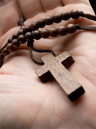 rosary in the hand with focus on the cross, shallow DOF Stock Photo - Budget Royalty-Free & Subscription, Code: 400-04136468