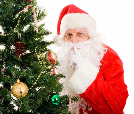 simsearch:400-04636742,k - Santa Claus is very quiet as he leaves gifts on Christmas morning.  Isolated on white. Foto de stock - Royalty-Free Super Valor e Assinatura, Número: 400-04136463