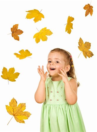rain little girl - Surprise heureuse petite fille avec des feuilles d'automne chutes - isolé Photographie de stock - Aubaine LD & Abonnement, Code: 400-04136496